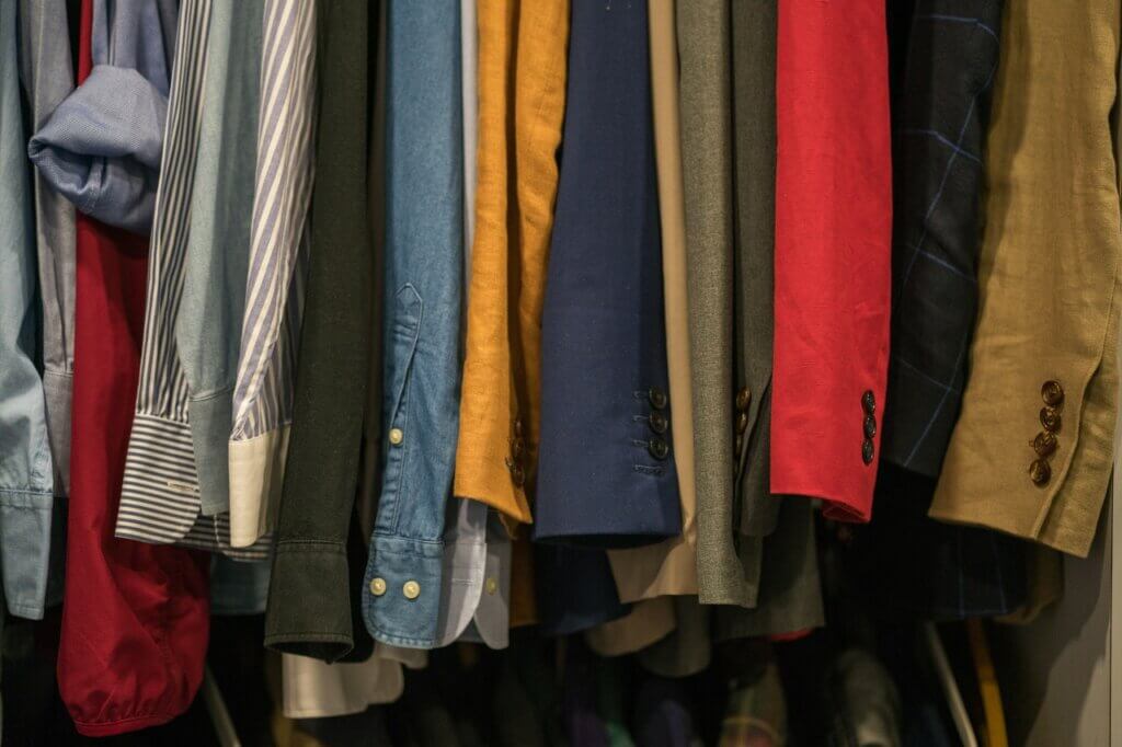 Wardrobe of different formal clothes with several colors.
