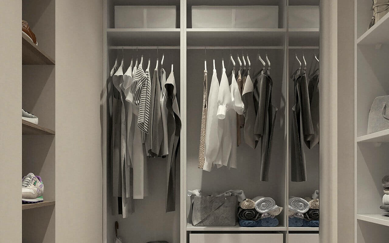 A cupboard full of non-iron shirts, dress pants, and shoes in a uniform colors.