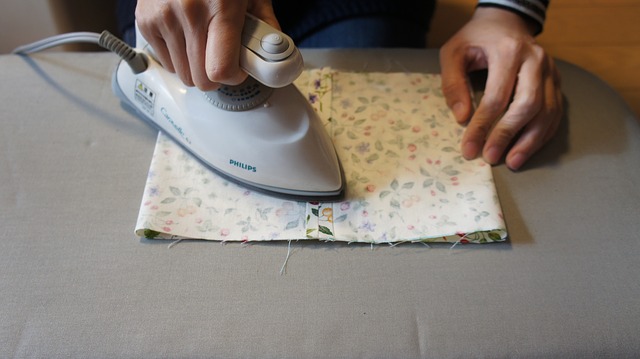 ironing piece of cloth on a grey matt but what is the difference between easy iron and non iron fabric