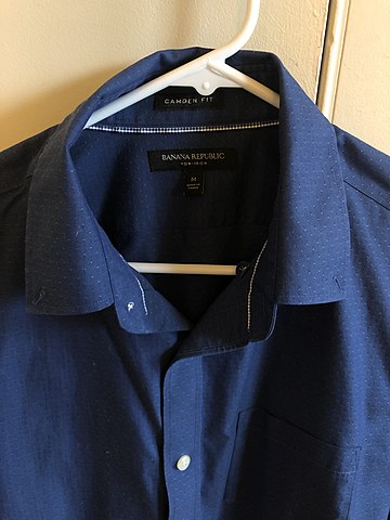 Blue color non iron shirt hanging