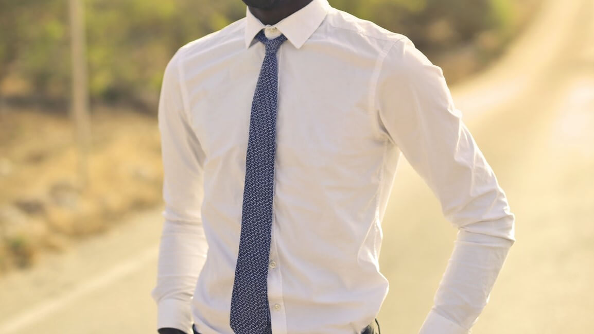 white non iron shirt with a blue tie