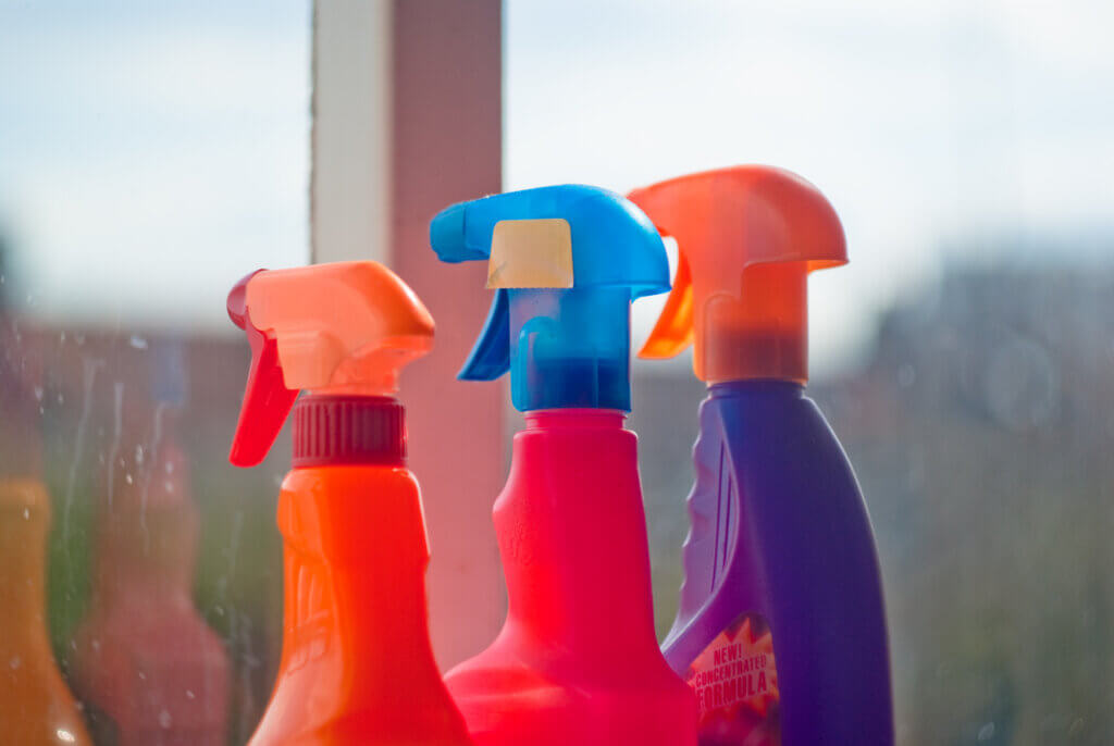 three colorful bottle sprinklers for damping shirts to iron
