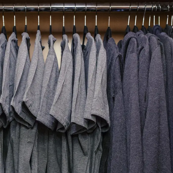Mark Zuckerberg closet of grey shirts, blue hoodies, jeans, and Nikes